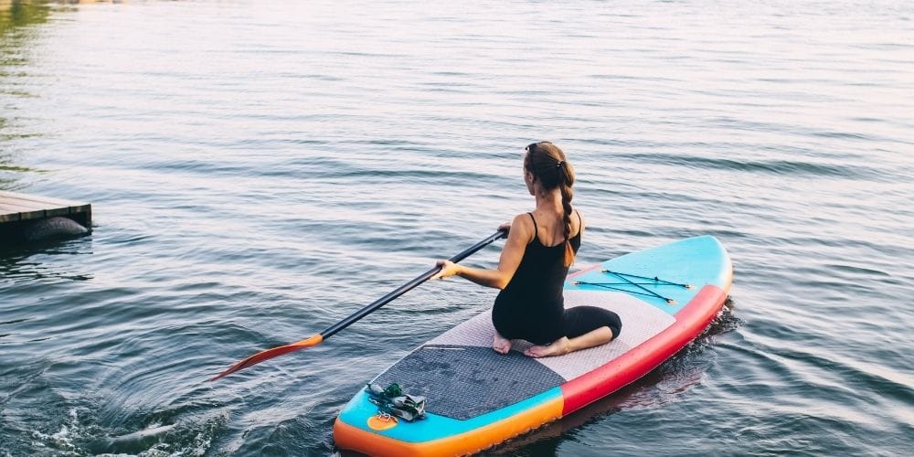 Best Spots for Paddleboarding and Kayaking Near Fire Island Rentals 4 Coastal kayaking in New York with open water views and shoreline landscapes